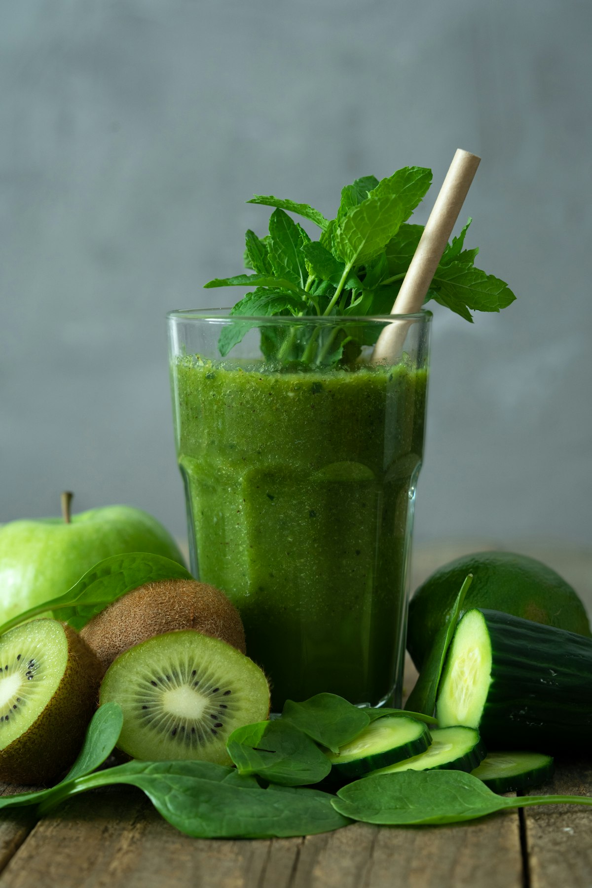 Green smoothie with fresh fruits and vegetables representing gut microbiome health and polyphenol nutrition